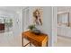 Welcoming foyer with stylish décor and access to the bathroom and living area at 4750 Dolphin Cay S Ln # 209, St Petersburg, FL 33711