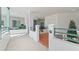 Charming condo featuring a private entrance, balcony, and lush landscaping at 4750 Dolphin Cay S Ln # 209, St Petersburg, FL 33711