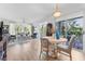 Spacious living room with a dining area, comfortable seating, and a view of the outdoor scenery at 4750 Dolphin Cay S Ln # 209, St Petersburg, FL 33711