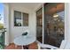 Charming patio featuring a mosaic table, comfortable seating, and sliding glass doors for indoor-outdoor living at 4750 Dolphin Cay S Ln # 209, St Petersburg, FL 33711