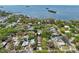 Aerial shot of a home with a coastal view, showcasing its location in a residential neighborhood near the water at 515 Orange St, Palm Harbor, FL 34683