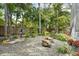 Spacious backyard featuring decorative landscaping and a variety of foliage around the property at 515 Orange St, Palm Harbor, FL 34683