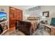 Cozy bedroom with wood floors, large closet, and a beautiful accent rug at 515 Orange St, Palm Harbor, FL 34683