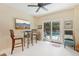 Breakfast nook with seating, a TV, and sliding glass doors leading to the pool at 515 Orange St, Palm Harbor, FL 34683