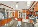Spacious kitchen with wooden cabinets, stainless steel appliances, granite countertops, and a center island at 515 Orange St, Palm Harbor, FL 34683
