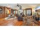 Living room with a fireplace, beamed ceiling, and stained glass windows at 515 Orange St, Palm Harbor, FL 34683