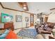 Inviting living room with a fireplace, spiral staircase, and comfortable leather furniture at 515 Orange St, Palm Harbor, FL 34683