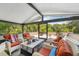 Relaxing outdoor seating with ample seating with comfortable cushions and coffee table at 515 Orange St, Palm Harbor, FL 34683