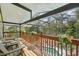 Relaxing screened porch with vaulted ceiling and a view of the pool and garden at 515 Orange St, Palm Harbor, FL 34683