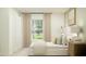 Well-lit bedroom featuring neutral tones, a cozy bed, elegant curtains, and a view of the outdoors at 5618 Red Kite Dr, Wimauma, FL 33598