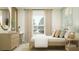Well-appointed bedroom with a streamlined desk, stylish decorations, natural textures, and soft natural light at 5618 Red Kite Dr, Wimauma, FL 33598