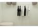 Organized closet with hanging clothes and ample storage space at 5618 Red Kite Dr, Wimauma, FL 33598