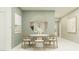 Elegant dining room featuring modern furnishings, neutral decor, sophisticated lighting, and an inviting atmosphere at 5618 Red Kite Dr, Wimauma, FL 33598