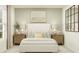 Serene main bedroom with a comfortable bed, neutral decor, stylish furniture, and soft natural light at 5618 Red Kite Dr, Wimauma, FL 33598
