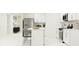 Modern kitchen with stainless steel appliances and sleek minimalist design at 5689 Yellow Hornbill Ave, Wimauma, FL 33598