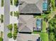 An aerial view showcases the home's roof, yard, and private backyard pool at 5809 Alabaster Stone Ln, Apollo Beach, FL 33572