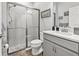 Stylish bathroom featuring modern fixtures, a walk-in shower, and neutral decor at 5809 Alabaster Stone Ln, Apollo Beach, FL 33572