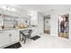 Bright bathroom with double sinks, vanity area, and large mirrors at 5809 Alabaster Stone Ln, Apollo Beach, FL 33572