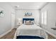 Inviting bedroom with plush bedding, stylish decor, and natural light from the windows at 5809 Alabaster Stone Ln, Apollo Beach, FL 33572