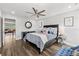 Bedroom with a ceiling fan, light walls, and a neatly made bed with decorative pillows at 5809 Alabaster Stone Ln, Apollo Beach, FL 33572