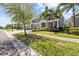 Charming two-story home with a three-car garage, well-manicured lawn, and inviting curb appeal at 5809 Alabaster Stone Ln, Apollo Beach, FL 33572