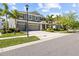 Charming two-story home with a three-car garage, well-manicured lawn, and inviting curb appeal at 5809 Alabaster Stone Ln, Apollo Beach, FL 33572