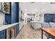 Well-appointed kitchen with custom cabinetry, wine rack, and stainless steel appliances at 5809 Alabaster Stone Ln, Apollo Beach, FL 33572