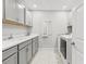 Well-organized laundry room with modern appliances and ample counter space at 5809 Alabaster Stone Ln, Apollo Beach, FL 33572
