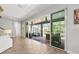 Indoor-outdoor living with sliding glass doors to screened patio and pool area at 5809 Alabaster Stone Ln, Apollo Beach, FL 33572