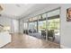 Indoor-outdoor living with sliding glass doors to screened patio and pool area at 5809 Alabaster Stone Ln, Apollo Beach, FL 33572