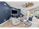 Cozy living room with staircase, stylish decor, and plenty of natural light at 5809 Alabaster Stone Ln, Apollo Beach, FL 33572