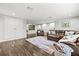 Spacious living room with cozy seating, wood floors, and natural light at 5809 Alabaster Stone Ln, Apollo Beach, FL 33572