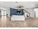 Bright living room with a ceiling fan, staircase, and sliding glass doors to outdoor area at 5809 Alabaster Stone Ln, Apollo Beach, FL 33572