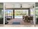 Expansive screened patio with lounge seating, dining area, and views of the pool at 5809 Alabaster Stone Ln, Apollo Beach, FL 33572