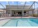 Luxury pool with outdoor seating, bar, and tv at 5809 Alabaster Stone Ln, Apollo Beach, FL 33572