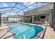 Inviting screened-in pool with an entertainment area at 5809 Alabaster Stone Ln, Apollo Beach, FL 33572