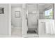 Glass shower with a pebble floor and subway tile, with a view into adjacent bathroom at 5809 Alabaster Stone Ln, Apollo Beach, FL 33572