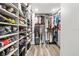 Well-organized walk-in closet featuring custom shelving and ample storage space for clothing and accessories at 5809 Alabaster Stone Ln, Apollo Beach, FL 33572