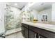 Modern bathroom boasts double sinks, granite countertops, and a luxurious marble tiled shower at 626 Diamond Ridge Rd, Seffner, FL 33584