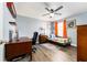 Bedroom featuring a ceiling fan, hardwood floors, and natural light from a window at 626 Diamond Ridge Rd, Seffner, FL 33584