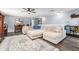 Spacious living room features a large sectional sofa, elegant rug, and wood-look floors at 626 Diamond Ridge Rd, Seffner, FL 33584