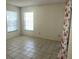 Bedroom with tiled flooring, natural light from a window, and light neutral walls at 6304 Pointe West Blvd # A206, Bradenton, FL 34209