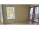 Bedroom with tiled flooring, natural light from a window, and light neutral walls at 6304 Pointe West Blvd # A206, Bradenton, FL 34209
