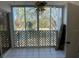 Enclosed screened patio with tiled floors and view of lush landscaping at 6304 Pointe West Blvd # A206, Bradenton, FL 34209
