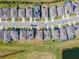 Aerial view of homes in a residential area, some with solar panels, bordering a scenic golf course at 6426 Bradford Woods Dr, Zephyrhills, FL 33542
