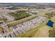 Panoramic aerial shot featuring a residential neighborhood with golf course views marked with a red pin at 6426 Bradford Woods Dr, Zephyrhills, FL 33542
