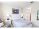Bedroom featuring neutral tones, comfortable sitting area, and bright natural light at 6426 Bradford Woods Dr, Zephyrhills, FL 33542