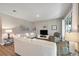 Bright living room featuring neutral colors, recessed lighting, comfortable seating, and glass tables at 6426 Bradford Woods Dr, Zephyrhills, FL 33542