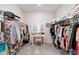 Spacious walk-in closet with organized storage and vanity area at 6426 Bradford Woods Dr, Zephyrhills, FL 33542