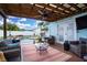 This backyard is relaxing with seating, a pool, and a ceiling fan above at 6513 14Th W Ave, Bradenton, FL 34209